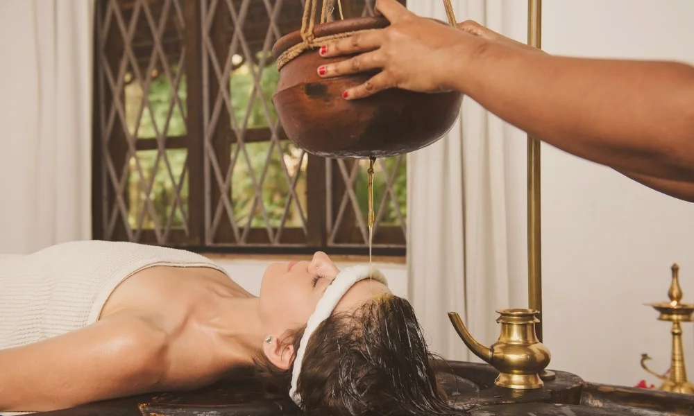 Foot massage in Coimbatore with therapist in a peaceful spa setting.