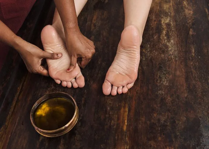 Ayurvedic foot massage with oil for ayurvedic massage in Coimbatore